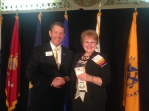 President Evelyn Brady receiving Five Star Level of Excellence Award from Gen Robertson, MOAA Chairman of the Board. Photo courtesy of Maj Gen Buck Marr